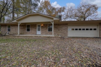 This lovely single-story home combines comfort, style, and on Hide-A-Way Lake Golf Course in Texas - for sale on GolfHomes.com, golf home, golf lot