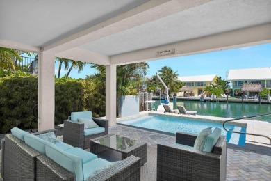 This well-maintained 2 Bedroom, 2 Bath elevated canal front half on Key Colony Beach Golf Course in Florida - for sale on GolfHomes.com, golf home, golf lot