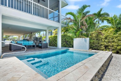 This well-maintained 2 Bedroom, 2 Bath elevated canal front half on Key Colony Beach Golf Course in Florida - for sale on GolfHomes.com, golf home, golf lot