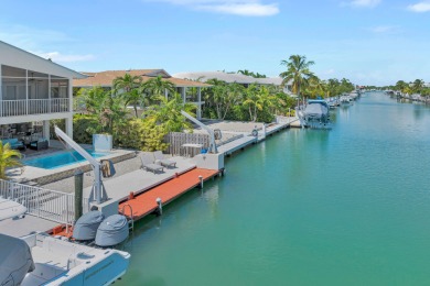 This well-maintained 2 Bedroom, 2 Bath elevated canal front half on Key Colony Beach Golf Course in Florida - for sale on GolfHomes.com, golf home, golf lot