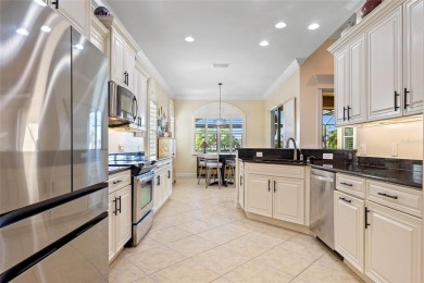 EXCEPTIONAL 2 BEDROOM + DEN, 2 BATH, 2-CAR GARAGE LAKEFRONT POOL on Riverwood Golf Club in Florida - for sale on GolfHomes.com, golf home, golf lot