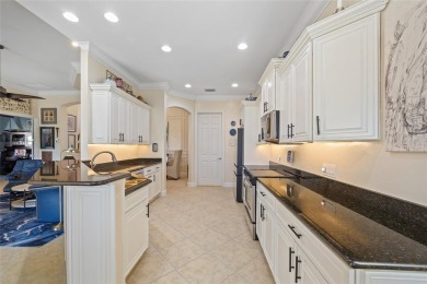 EXCEPTIONAL 2 BEDROOM + DEN, 2 BATH, 2-CAR GARAGE LAKEFRONT POOL on Riverwood Golf Club in Florida - for sale on GolfHomes.com, golf home, golf lot