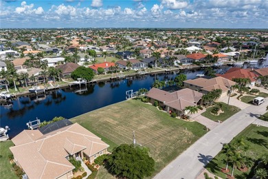 VACANT, WATERFRONT LOT IN BURNT STORE ISLES - This oversized on Twin Isles Country Club in Florida - for sale on GolfHomes.com, golf home, golf lot