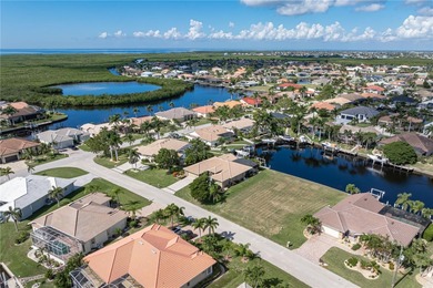 VACANT, WATERFRONT LOT IN BURNT STORE ISLES - This oversized on Twin Isles Country Club in Florida - for sale on GolfHomes.com, golf home, golf lot