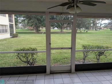 Just Reduced! This beautifully renovated 3-bedroom, 2-bathroom on Woodmont Country Club in Florida - for sale on GolfHomes.com, golf home, golf lot