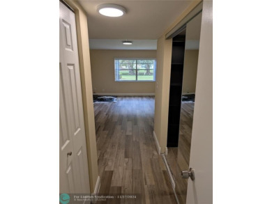 Just Reduced! This beautifully renovated 3-bedroom, 2-bathroom on Woodmont Country Club in Florida - for sale on GolfHomes.com, golf home, golf lot