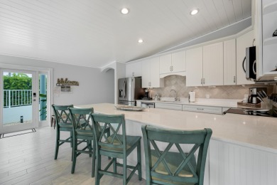 This Key Colony Beach coastal retreat blends modern elegance on Key Colony Beach Golf Course in Florida - for sale on GolfHomes.com, golf home, golf lot