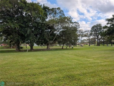 Just Reduced! This beautifully renovated 3-bedroom, 2-bathroom on Woodmont Country Club in Florida - for sale on GolfHomes.com, golf home, golf lot