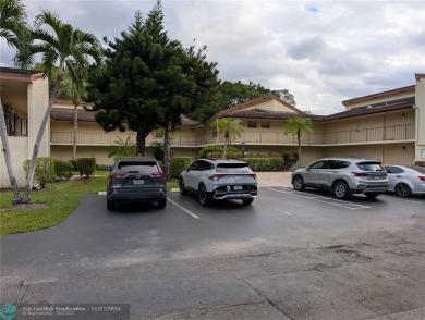 Just Reduced! This beautifully renovated 3-bedroom, 2-bathroom on Woodmont Country Club in Florida - for sale on GolfHomes.com, golf home, golf lot