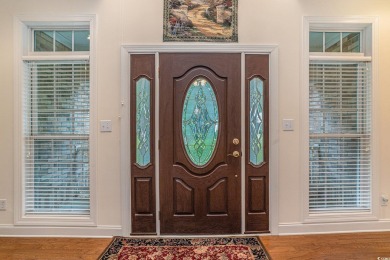 Elegance meets timeless Southern charm in this exquisite on Pawleys Plantation Golf and Country Club in South Carolina - for sale on GolfHomes.com, golf home, golf lot