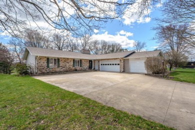 This fantastic home overlooks the 14th green of Lake Cora Hills on Lake Cora Hills Golf Club in Michigan - for sale on GolfHomes.com, golf home, golf lot