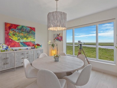 Experience refined coastal living in this elegant residence at on Hammock Bay in Florida - for sale on GolfHomes.com, golf home, golf lot