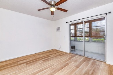 Beautifully remodeled first-floor unit filled with natural light on Hillsboro Pines Golf in Florida - for sale on GolfHomes.com, golf home, golf lot