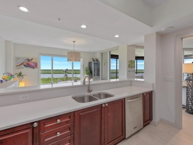 Experience refined coastal living in this elegant residence at on Hammock Bay in Florida - for sale on GolfHomes.com, golf home, golf lot