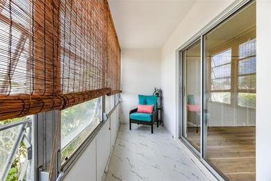 Beautifully remodeled first-floor unit filled with natural light on Hillsboro Pines Golf in Florida - for sale on GolfHomes.com, golf home, golf lot