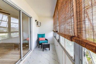 Beautifully remodeled first-floor unit filled with natural light on Hillsboro Pines Golf in Florida - for sale on GolfHomes.com, golf home, golf lot