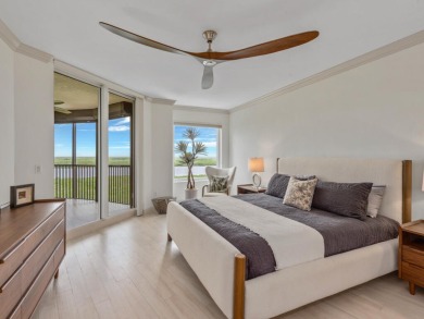 Experience refined coastal living in this elegant residence at on Hammock Bay in Florida - for sale on GolfHomes.com, golf home, golf lot