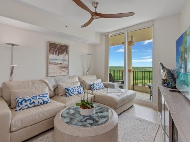 Experience refined coastal living in this elegant residence at on Hammock Bay in Florida - for sale on GolfHomes.com, golf home, golf lot