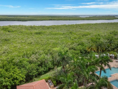 Experience refined coastal living in this elegant residence at on Hammock Bay in Florida - for sale on GolfHomes.com, golf home, golf lot