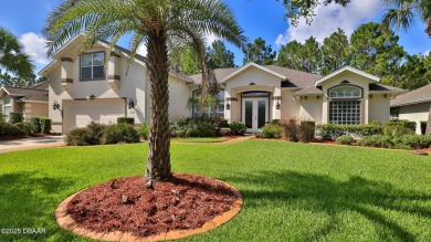 Discover the Florida lifestyle in this pool home-offered on Plantation Bay Golf and Country Club in Florida - for sale on GolfHomes.com, golf home, golf lot