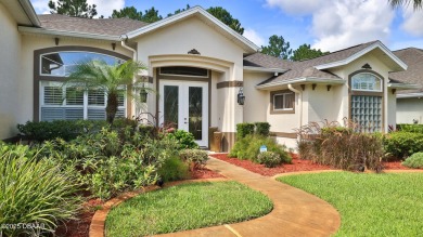 Discover the Florida lifestyle in this pool home-offered on Plantation Bay Golf and Country Club in Florida - for sale on GolfHomes.com, golf home, golf lot