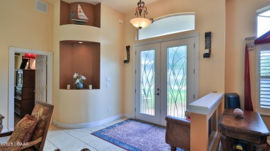 Discover the Florida lifestyle in this pool home-offered on Plantation Bay Golf and Country Club in Florida - for sale on GolfHomes.com, golf home, golf lot