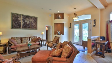 Discover the Florida lifestyle in this pool home-offered on Plantation Bay Golf and Country Club in Florida - for sale on GolfHomes.com, golf home, golf lot