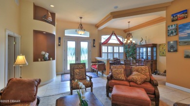 Discover the Florida lifestyle in this pool home-offered on Plantation Bay Golf and Country Club in Florida - for sale on GolfHomes.com, golf home, golf lot