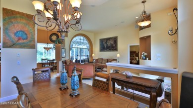 Discover the Florida lifestyle in this pool home-offered on Plantation Bay Golf and Country Club in Florida - for sale on GolfHomes.com, golf home, golf lot