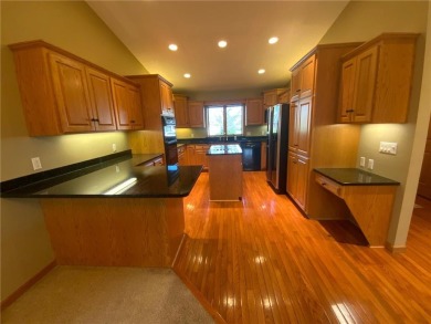 Welcome to this stunning, move-in-ready home located on the 14th on River Oaks Golf Club in Minnesota - for sale on GolfHomes.com, golf home, golf lot