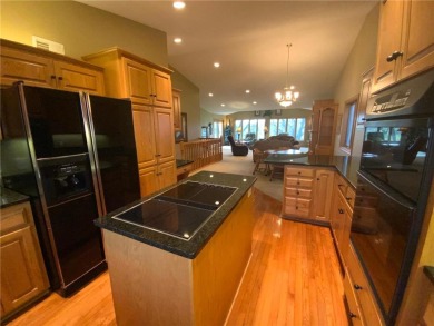 Welcome to this stunning, move-in-ready home located on the 14th on River Oaks Golf Club in Minnesota - for sale on GolfHomes.com, golf home, golf lot