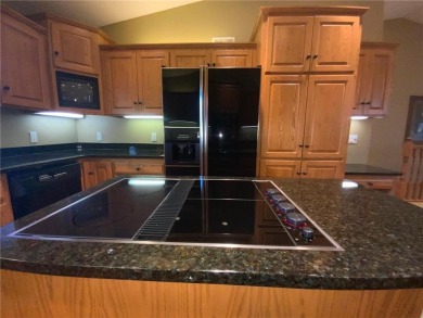 Welcome to this stunning, move-in-ready home located on the 14th on River Oaks Golf Club in Minnesota - for sale on GolfHomes.com, golf home, golf lot