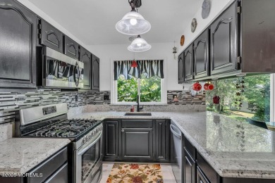 Exceptional greenport model home on quiet cul-de-sac backing to on Greenbriar Woodlands in New Jersey - for sale on GolfHomes.com, golf home, golf lot