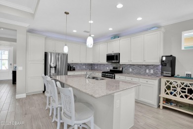 Tropical-inspired Coconut model single-family pool & spa home on LPGA International Golf Course in Florida - for sale on GolfHomes.com, golf home, golf lot