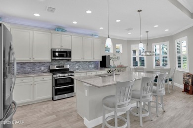 Tropical-inspired Coconut model single-family pool & spa home on LPGA International Golf Course in Florida - for sale on GolfHomes.com, golf home, golf lot