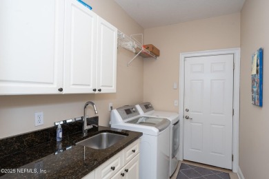 Stunning, light-filled home in JGCC on a private lot with on Jacksonville Golf and Country Club in Florida - for sale on GolfHomes.com, golf home, golf lot