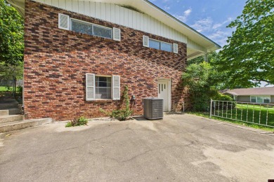 Discover this beautifully remodeled home just one minute from on Big Creek Golf and Country Club in Arkansas - for sale on GolfHomes.com, golf home, golf lot