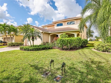 Discover exceptional living in this stunning two-story residence on Valencia Golf and Country Club in Florida - for sale on GolfHomes.com, golf home, golf lot