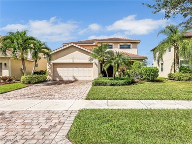 Discover exceptional living in this stunning two-story residence on Valencia Golf and Country Club in Florida - for sale on GolfHomes.com, golf home, golf lot