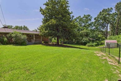 Discover this beautifully remodeled home just one minute from on Big Creek Golf and Country Club in Arkansas - for sale on GolfHomes.com, golf home, golf lot