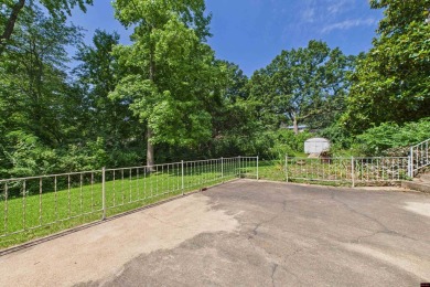 Discover this beautifully remodeled home just one minute from on Big Creek Golf and Country Club in Arkansas - for sale on GolfHomes.com, golf home, golf lot