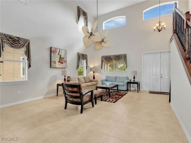 Discover exceptional living in this stunning two-story residence on Valencia Golf and Country Club in Florida - for sale on GolfHomes.com, golf home, golf lot