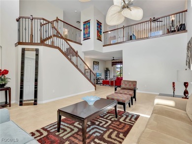 Discover exceptional living in this stunning two-story residence on Valencia Golf and Country Club in Florida - for sale on GolfHomes.com, golf home, golf lot