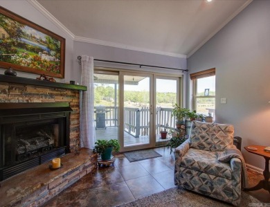 Discover your dream home that boasts breathtaking lake and golf on Diamondhead Golf and Country Club in Arkansas - for sale on GolfHomes.com, golf home, golf lot