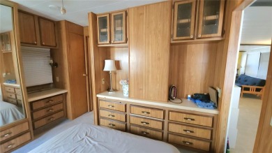 DOUBLE WIDE MOBILE HOME in active 55+ community. FIXER-UPPER IS on River Run Golf Links in Florida - for sale on GolfHomes.com, golf home, golf lot