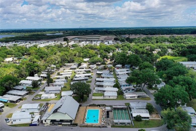 DOUBLE WIDE MOBILE HOME in active 55+ community. FIXER-UPPER IS on River Run Golf Links in Florida - for sale on GolfHomes.com, golf home, golf lot