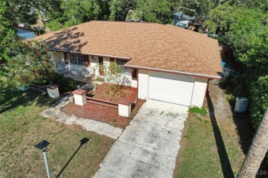 Welcome home! This delightful 3-bedroom, 2-bathroom, and 1-car on Citrus Springs Country Club in Florida - for sale on GolfHomes.com, golf home, golf lot