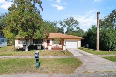 Welcome home! This delightful 3-bedroom, 2-bathroom, and 1-car on Citrus Springs Country Club in Florida - for sale on GolfHomes.com, golf home, golf lot