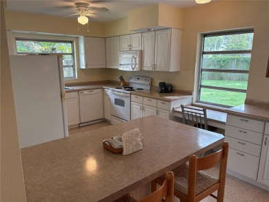 Welcome to this spacious move in ready home in one of the best on The Dunedin Country Club in Florida - for sale on GolfHomes.com, golf home, golf lot