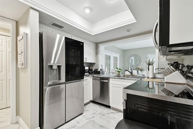 Welcome to your dream home in the prestigious Cypress Clusters on Carrollwood Country Club in Florida - for sale on GolfHomes.com, golf home, golf lot